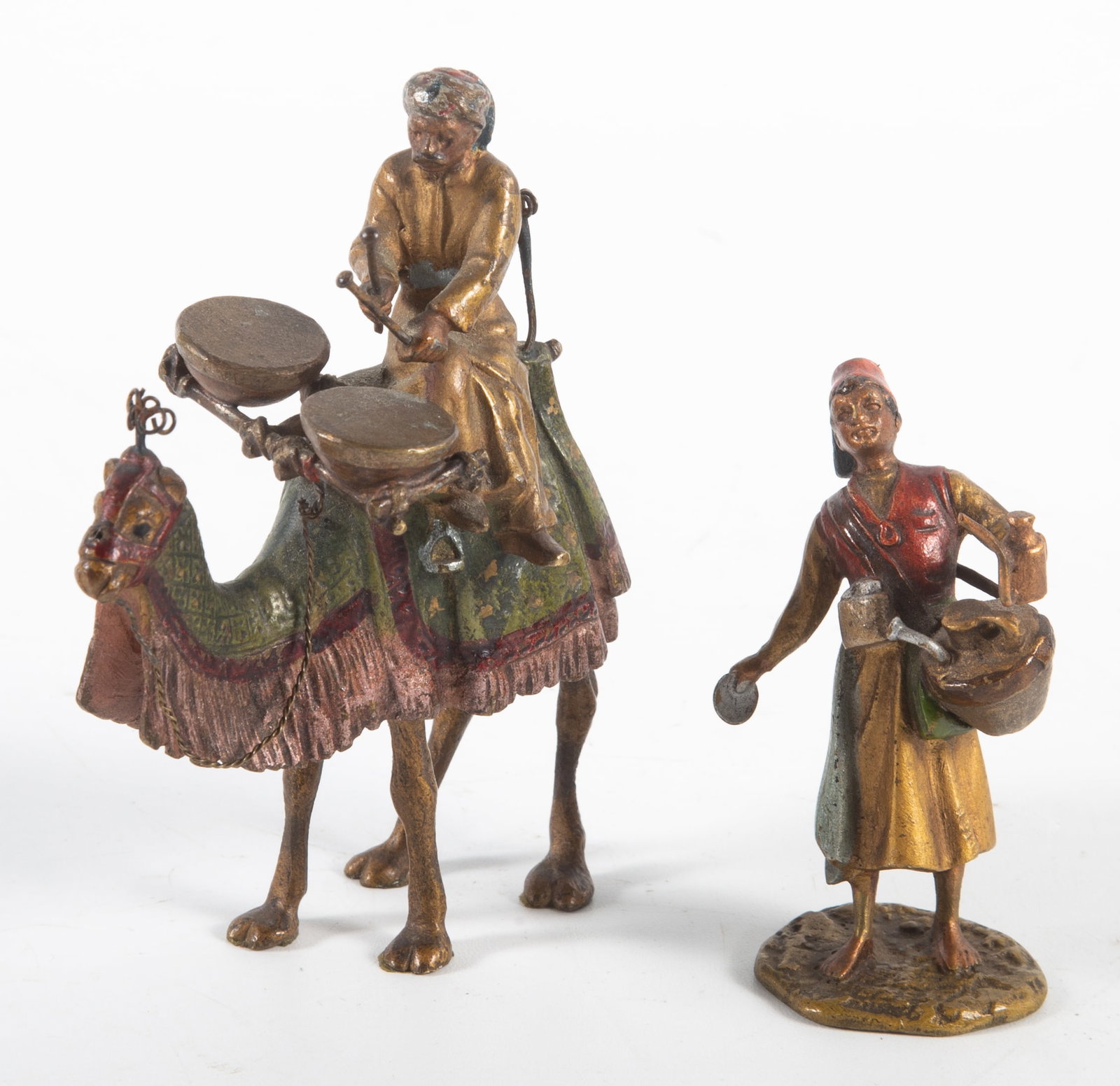 (2) AUSTRIAN BRONZES: Contemporary - (1) woman server, stamped "Austria"; (1) camel drummer, unmarked; tallest 3 1/2"; normal wear, VG-EX