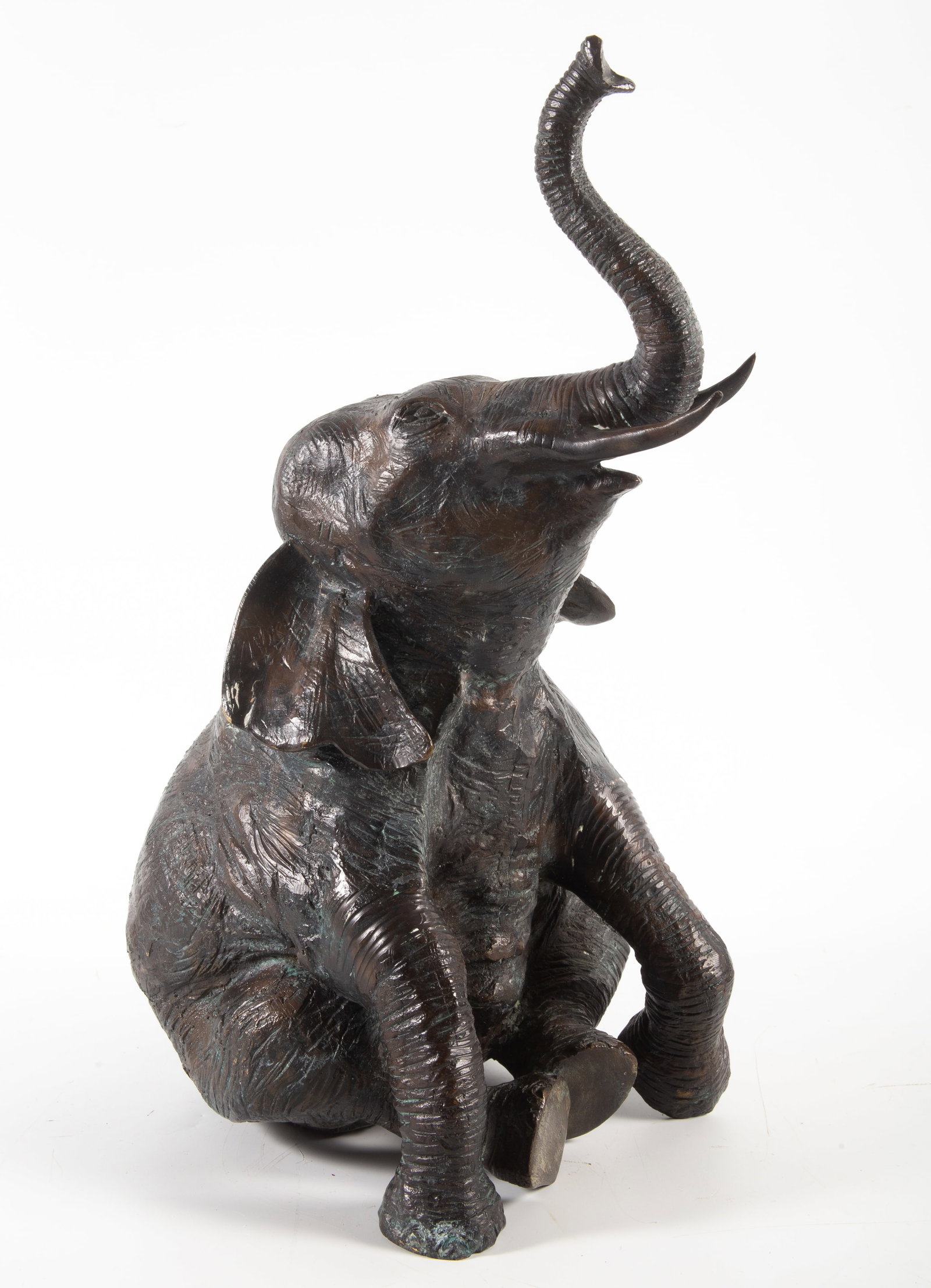 LARGE SEATED ELEPHANT: Hollow bronze patinated figure, H-19"xD-10", normal wear, G-VG