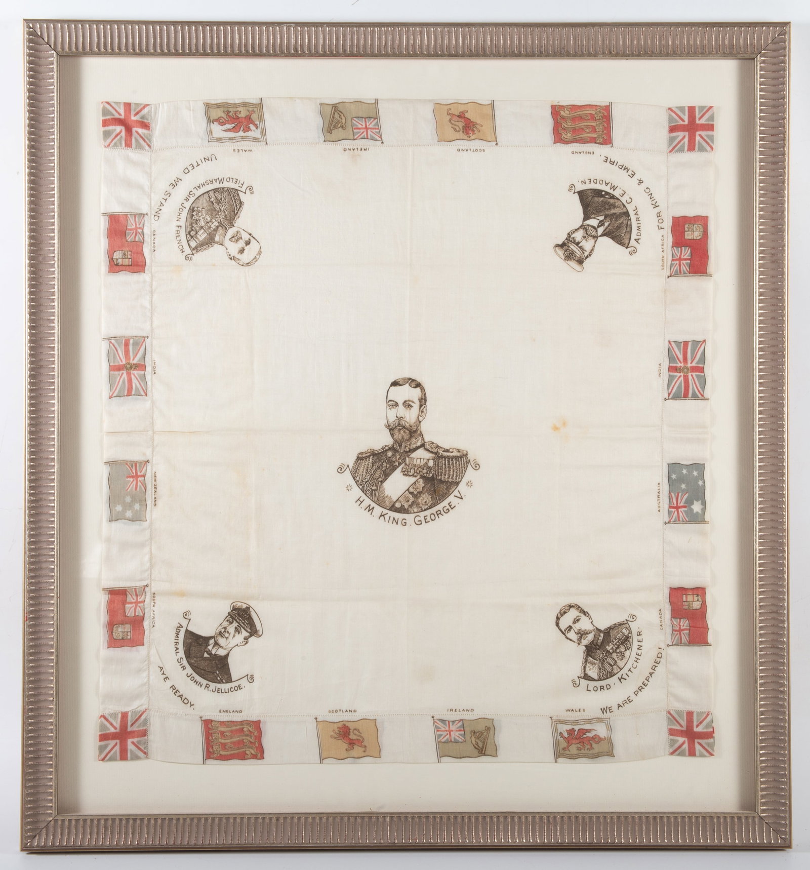 ENGLAND MILITARY SILK: Printed on silk with images of King George V, together with his military staff and flags of English sovereigns, frame 26"x24", slight toning, G-VG
