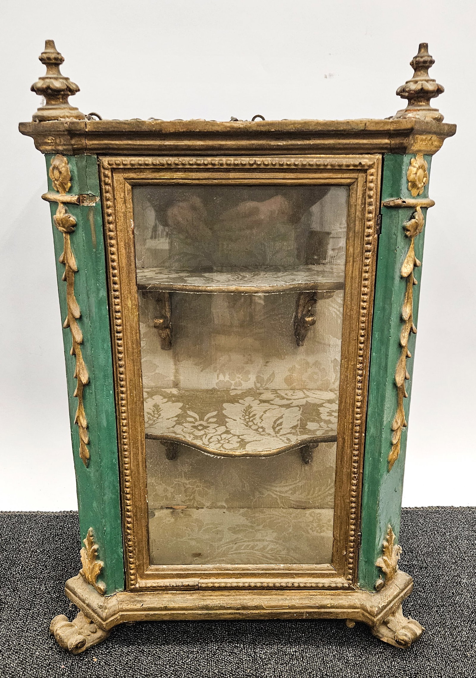 ANTIQUE CONTINENTAL HANGING VITRINE: Painted and parcel gilt decoration; silk lined; two shelf interior; H-28", L-17", 9" deep; G