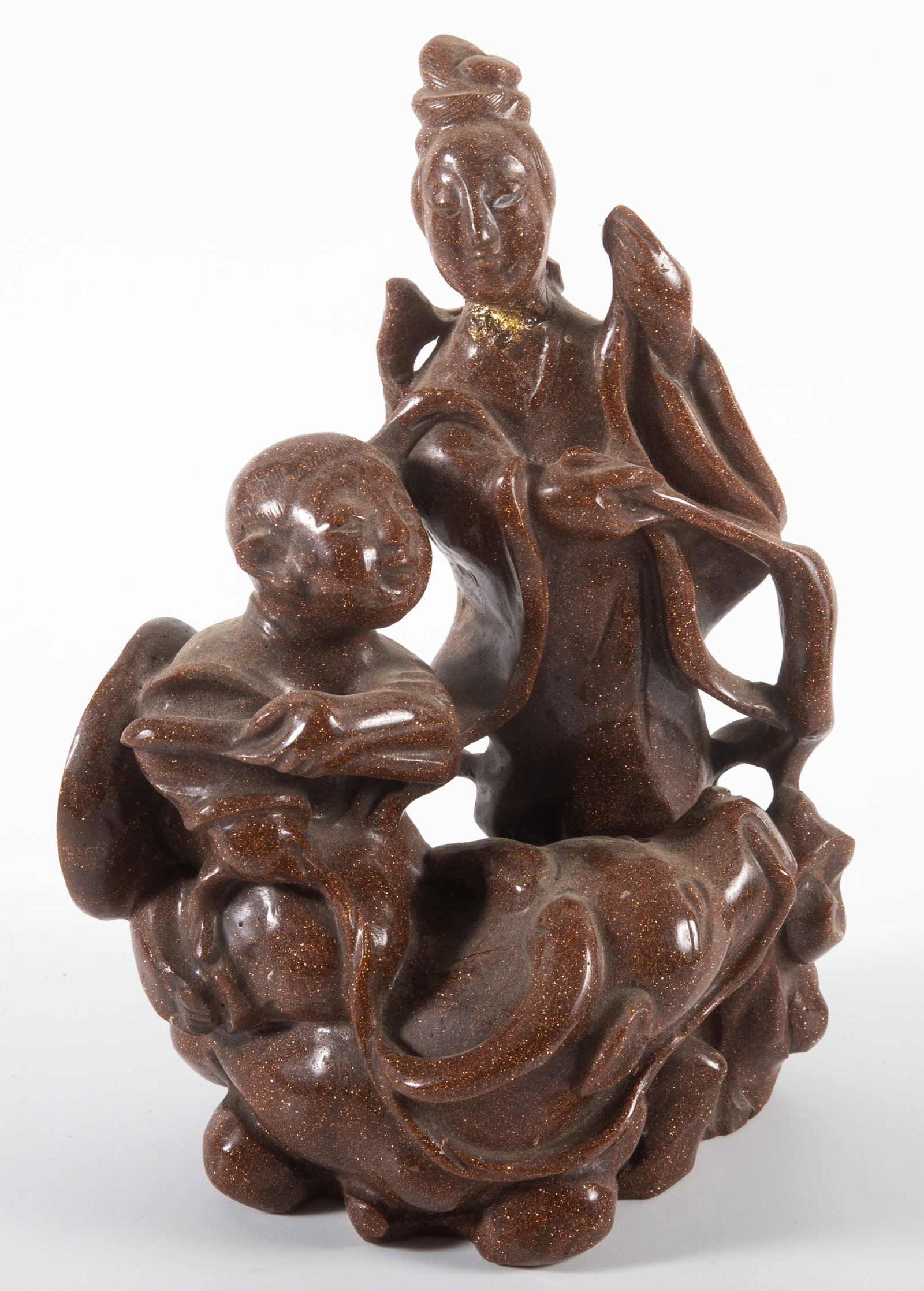 GOLDSTONE FIGURAL CARVING: Woman, man, and buffalo; H-8 1/2"; woman repaired at neck, wear, minor losses, F-G