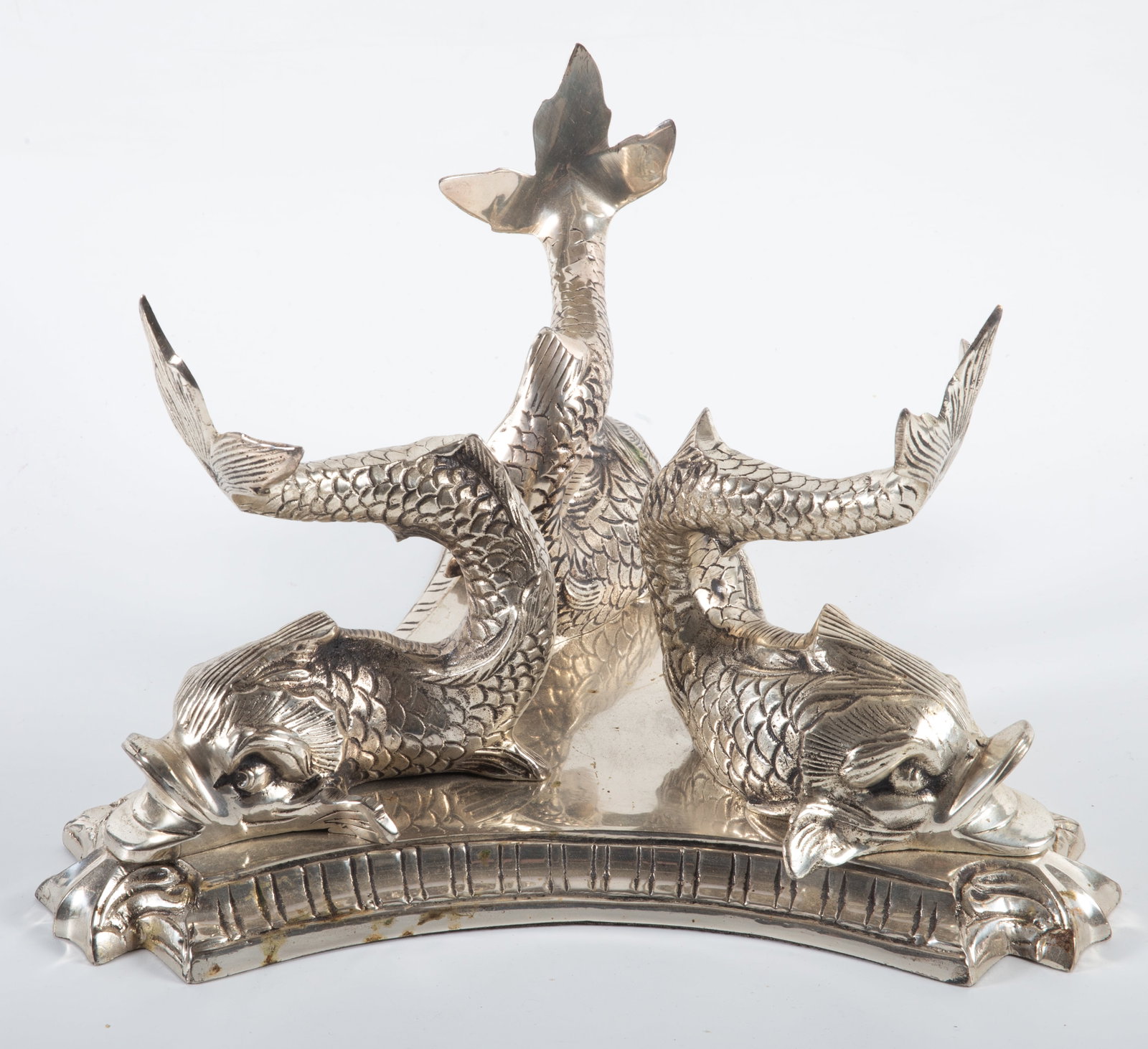 PLATED DOLPHIN STAND: Base comprised of (3) dolphins in a polished metal plate on triangular base - no insert; H-7 1/2"xD-11"; normal wear, G