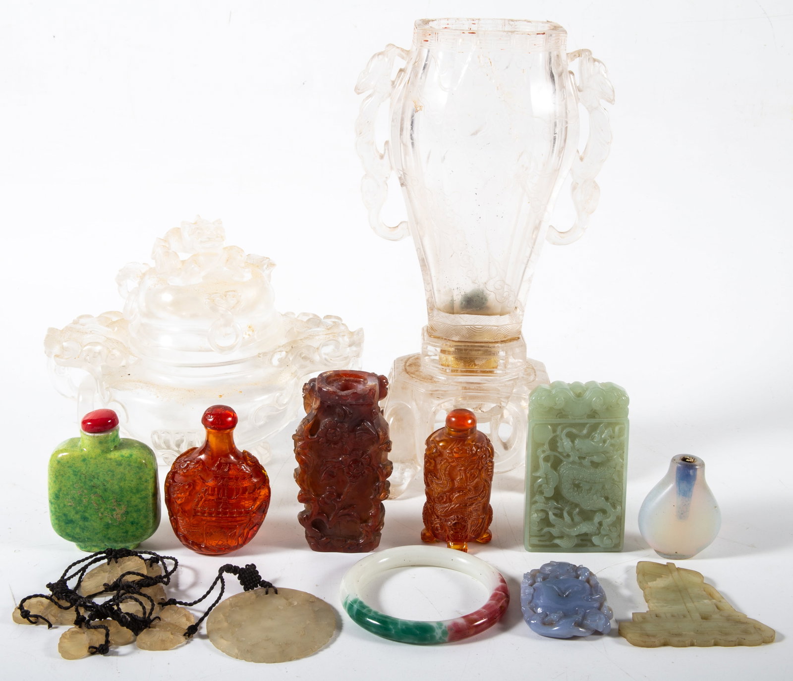 ASIAN JADE / STONE: (1) Rock crystal lidded jar; (1) rock crystal vase, badly damaged; (5) snuff bottles- one is composition, two missing stoppers; (5) assorted pieces; wear, vase height: 10", P-VG