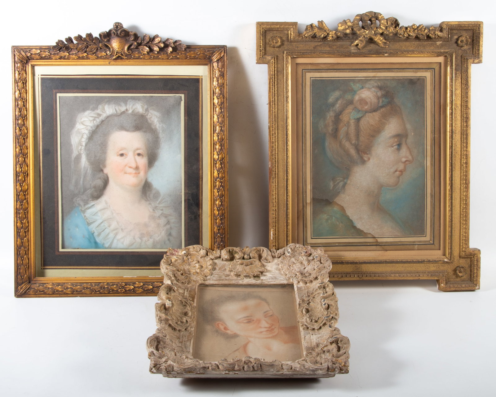 (3) ANTIQUE PORTRAIT PASTELS: All framed; frame wear and loss, lady with hair up is stained in lower portion; largest: 22"x18", F-G