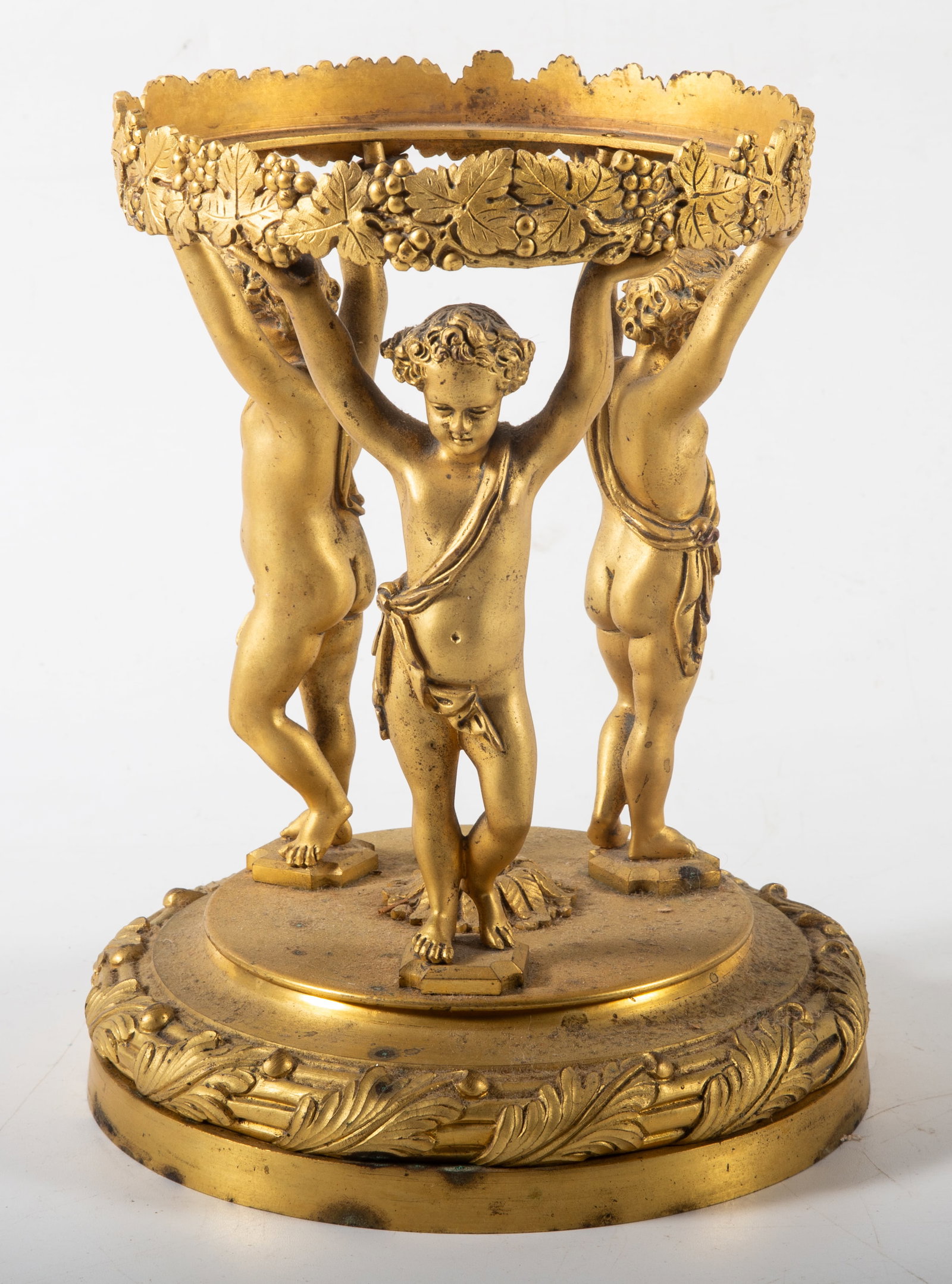 GILT BRONZE COMPOTE BASE: Ornate cherub base which probably held a crystal bowl; H-8", diameter of opening: 5 1/8", G-VG