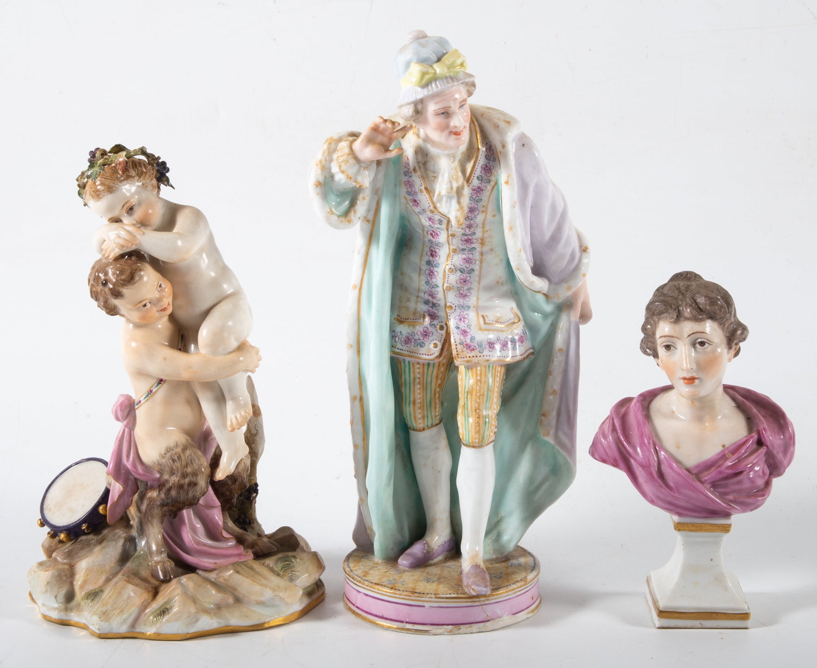 (3) MEISSEN ETC. FIGURES: Painted porcelain; (1) Meissen- cherubs playing, repair to tree, chips on wreath; (1) bust, unmarked, neck repair; (1) gentleman listening, repair to base; H: 5"-9", F