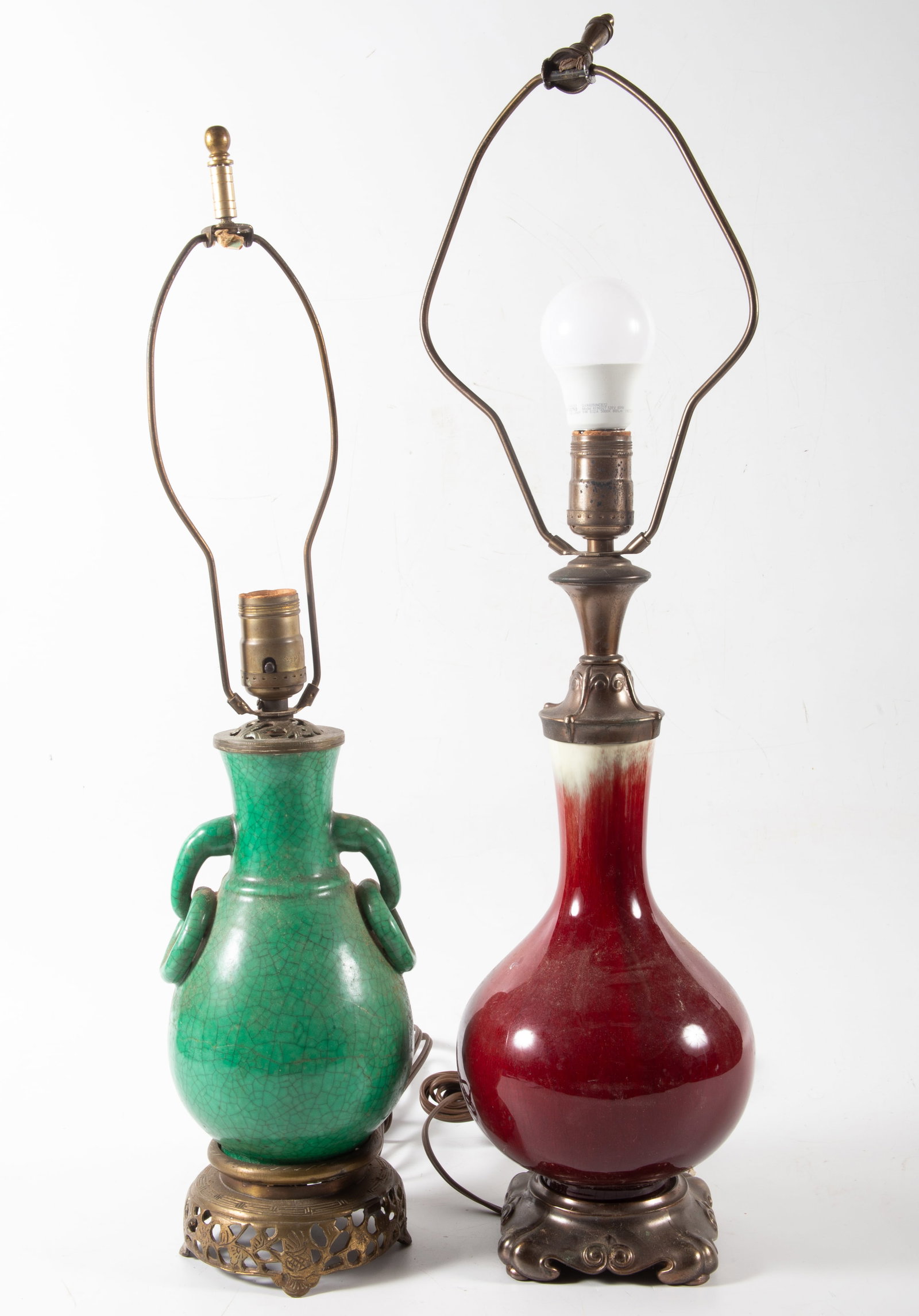 (2) ASIAN INFLUENCE TABLE LAMPS: (1) Sang de boeuf, H-26"; (1) green glaze, uniform crazing, H-22"; normal wear, need rewiring, F-G