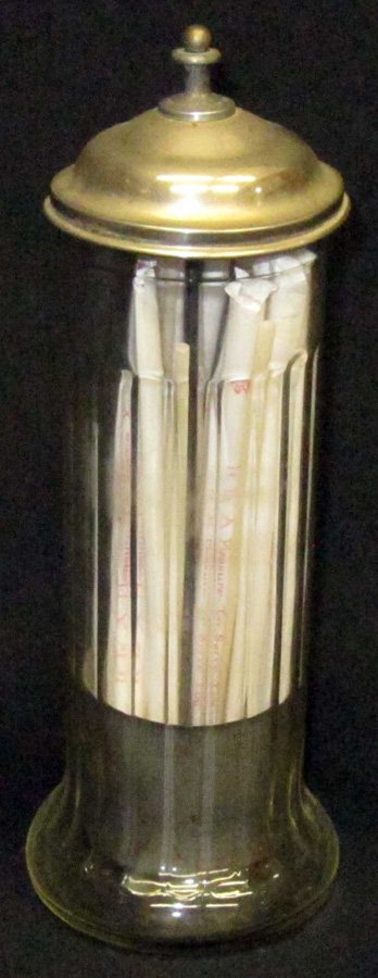 CLEAR GLASS STRAW HOLDER: 20 panel; metal lid with lifter and spinning finial; patent dates 1912 & 1915; H-12 1/2", VG-EX