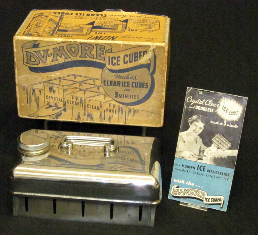 DU-MORE ICE CUBER: Chrome plated; Martocello & Co. Phila.; great graphic original box; "makes clear ice cubes in 3 mins"; has original pamphlet; box has wear and toning; does not have original fork for removing cubes; L