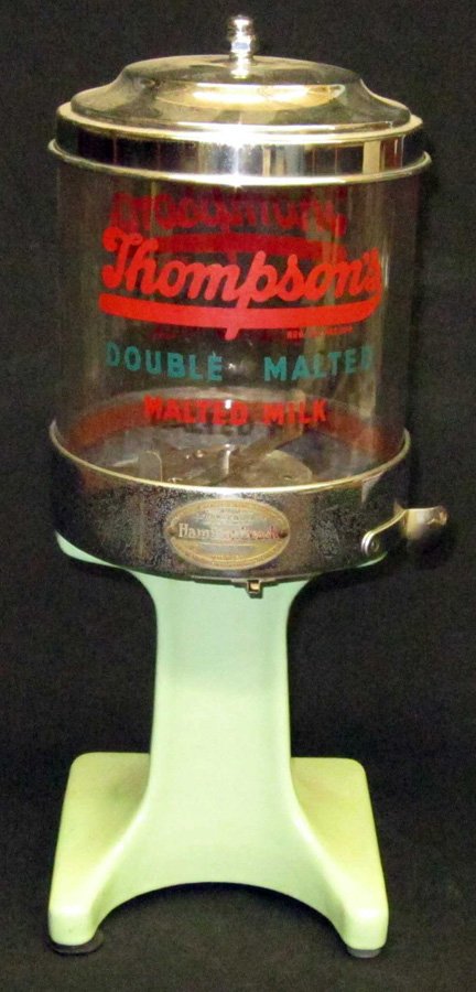 ARNOLD MALTED MILK DISPENSER: Hamilton Beach #20B; glass top with "Thompsons" lettering; green porcelain base with chrome top; chrome pitted; H-19", G-VG