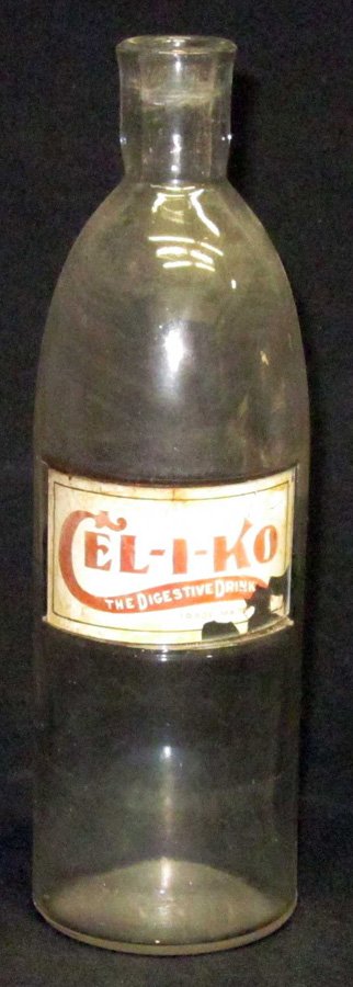 SODA FOUNTAIN CEL-I-KO SYRUP BOTTLE: Glass with reverse glass label; label flaking and dirty; bottle slightly cloudy; H-11", F