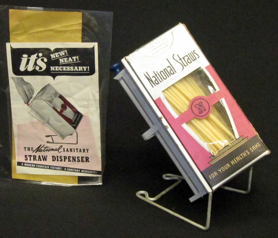 THE NATIONAL SANITARY STRAW DISPENSER: Counter-top; metal holder with turning knob; cardboard shipping box slips in; together with instructions and pamphlet; L-10", VG-EX