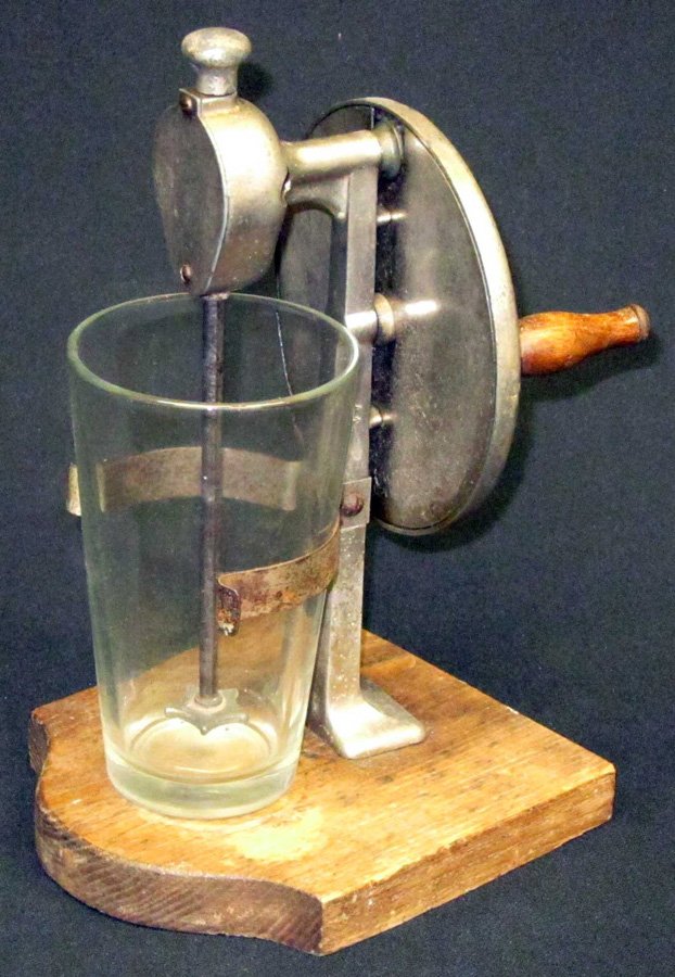 EARLY KWIKMIX MIXER: Hand crank on wood base; some metal pitting and blemishes; H-10 1/2", G