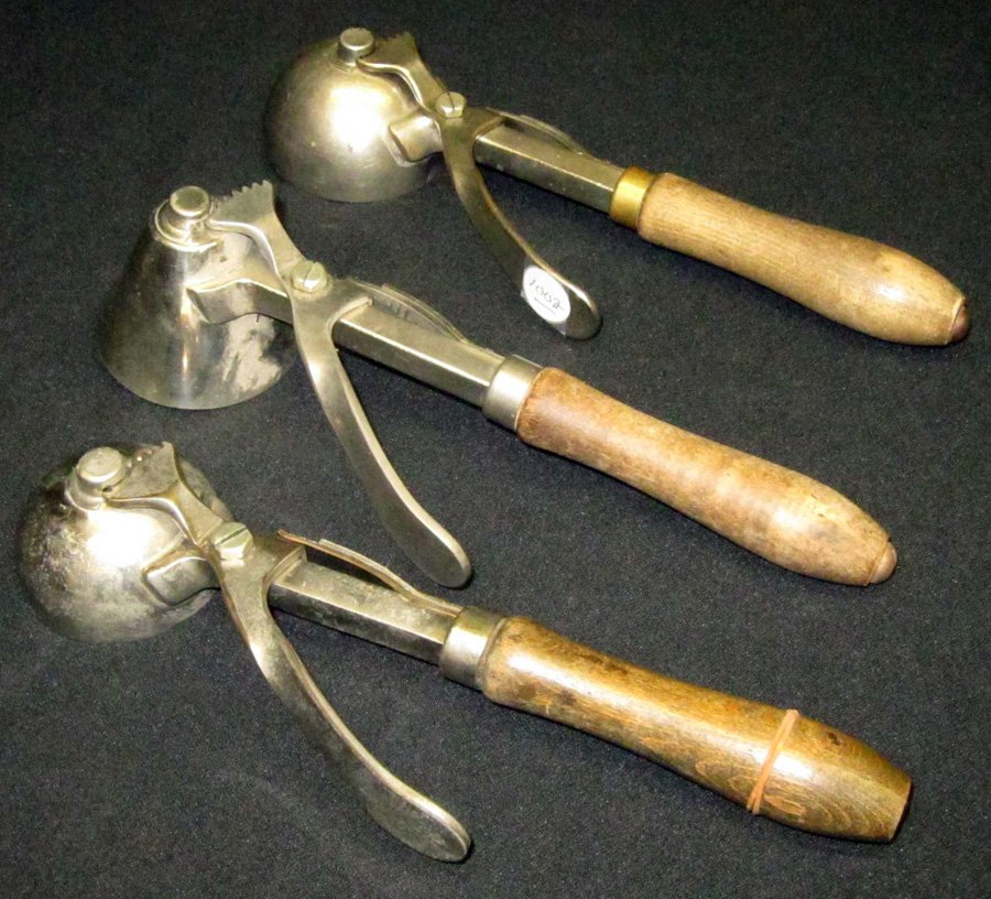 BENEDICT INDESTRUCTO ICE CREAM SCOOPS (3): (1) No. 3 [10], leaf spring, L-10"; (1) No. 3 [16], leaf spring, L-9 1/2"; (1) No. 5 [12], conical, leaf spring, L-10"; original finish; G-VG