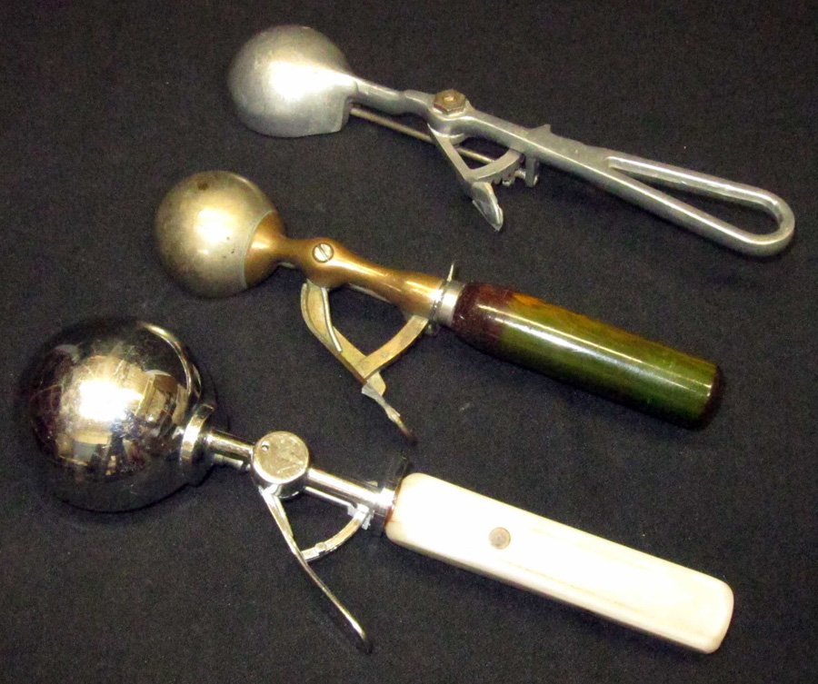 UNMARKED ICE CREAM SCOOPS (3): (1) Gilchrist No. 30 [24], squeeze, polished, L-9"; (1) [20], marble, square sides to handle, L-10"; (1) [10], L-9 1/2"; original finish; G