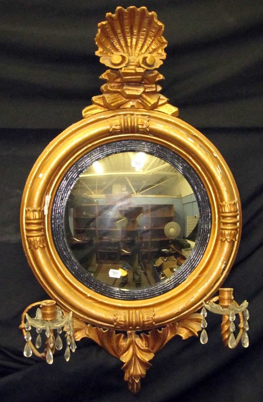 FEDERAL CONVEX MIRROR SCONCE: Gilt and gesso wood frame with convex mirror, candle holders are cast metal; cut crystal bobeches and prisms; gesso and gilt decoration; flaking and loss; (1) point on bobeche chipped; inner black rim