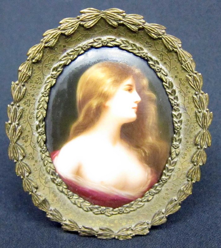 MINIATURE PAINTING ON PORCELAIN: Young woman with flowing hair; (1) breast exposed; unsigned; impressed "H R" on reverse; cast brass oval frame; H-3", VG-EX