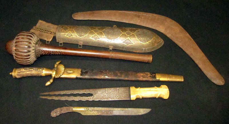 WEAPONS, ARMOR, ETC. (6): (1) Antler knife with bronze acorns; (1) ivory handled Eastern split blade knife; (1) boomerang; (1) wooden club; (1) piece of Eastern armor; (1) part of Eastern knife; L-11"-22", P-G