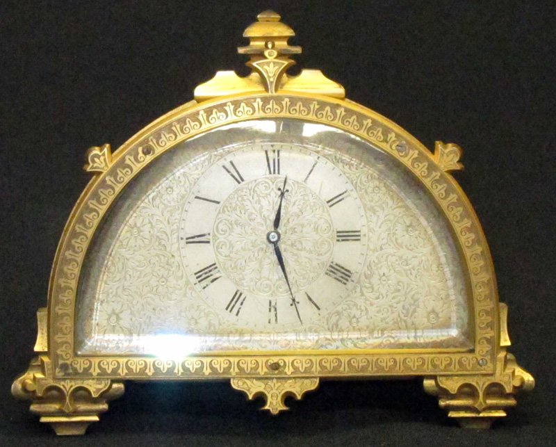AESTHETIC BRONZE DESK CLOCK: Floral engraved silver face; beveled glass; easel back; runs; numerals faded; L-7",
