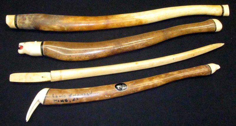 ESKIMO CLUBS & SPEAR (4): (3) petrified clubs with ivory caps, (1) ivory spear; L-16"-24", G