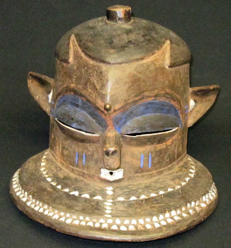 AFRICAN HELMET MASK: Pende, D.R.C., painted, carved wood; wood splitting at base of nose; H-11", F-G
