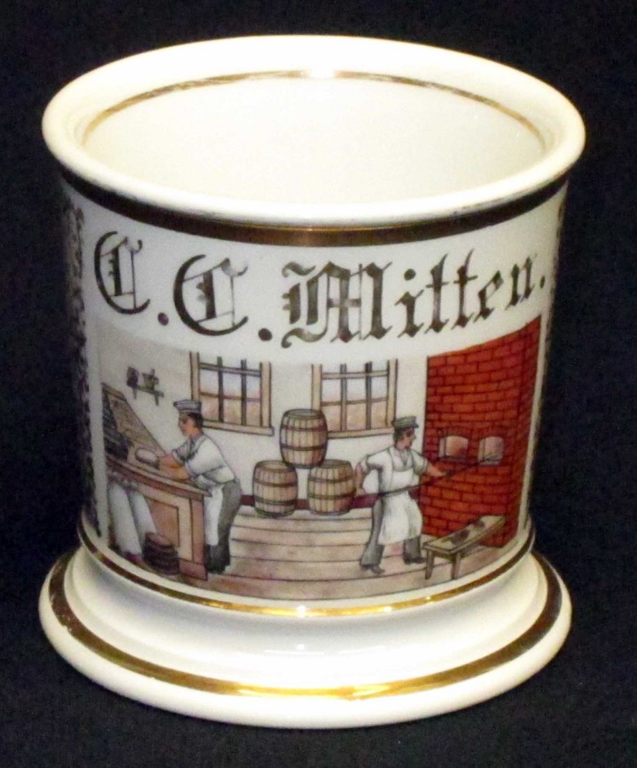 BAKER OCCUPATIONAL SHAVING MUG: Painted porcelain; C. C. Mitten; bottom marked T & V Limoges France; repaired handle and surrounding area; gilt paint loss mostly top edge; H-3 3/4", F
