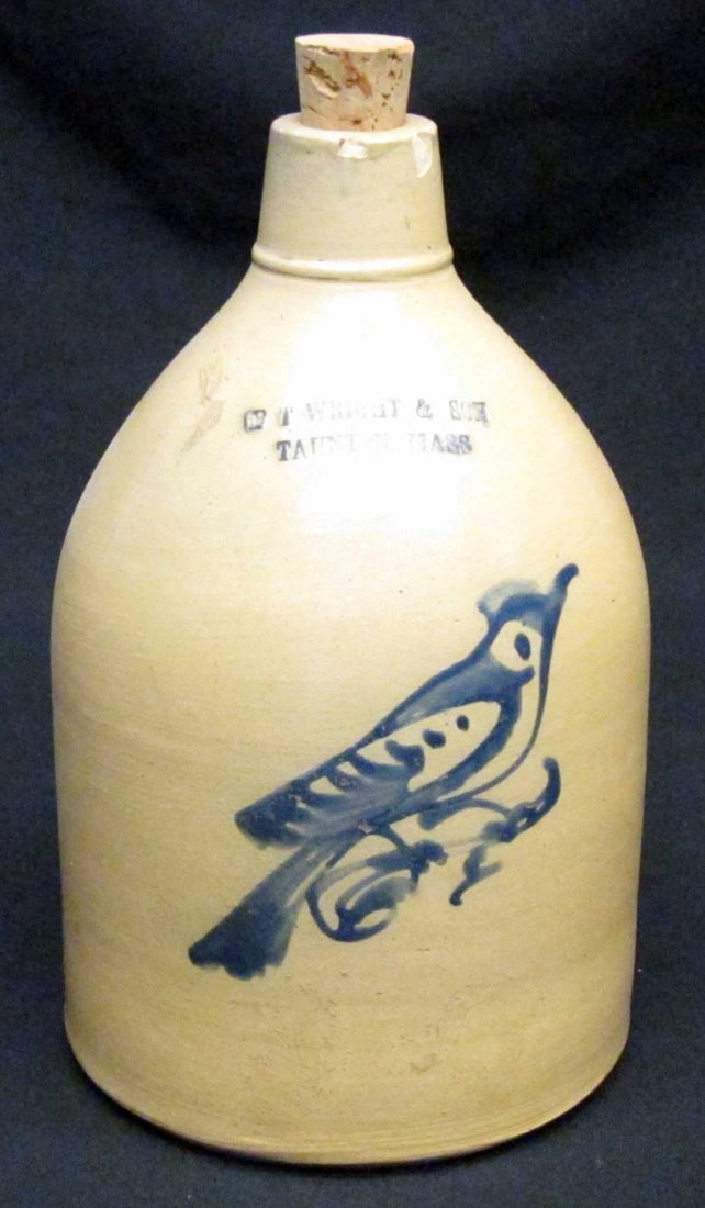 BLUE DECORATED STONEWARE JUG: F. T. Wright & Son, Taunton Mass.; free form bird design; (2) small spout chips; H-12", G