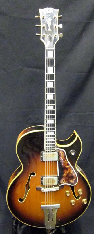 GIBSON CUSTOM L5 GUITAR: Paper label "#849723", acoustic electric; six string; wood body; guard cracked and damaged; some pitting and wear to metal fixtures; L-41 1/2", F-G