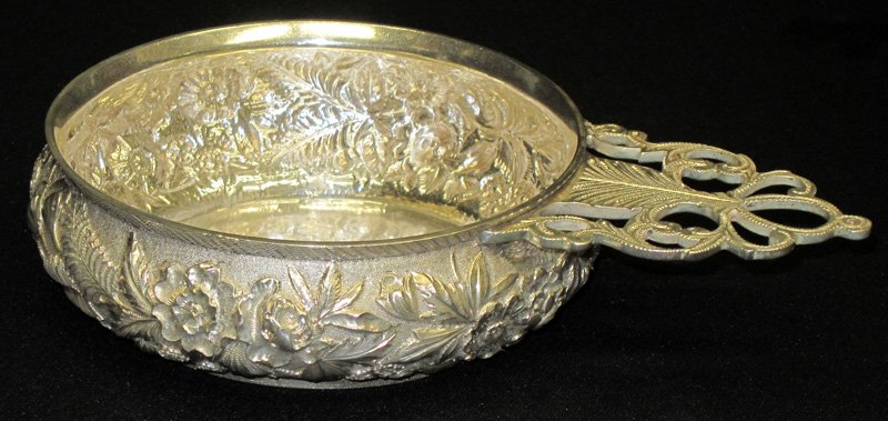 S. KIRK & SON STERLING REPOUSSE PORRINGER: Repousse body; engraved openwork handle; hand chased; bottom personalized with name and date; small dings in bottom; 10 TO+/-; L-8", VG-EX