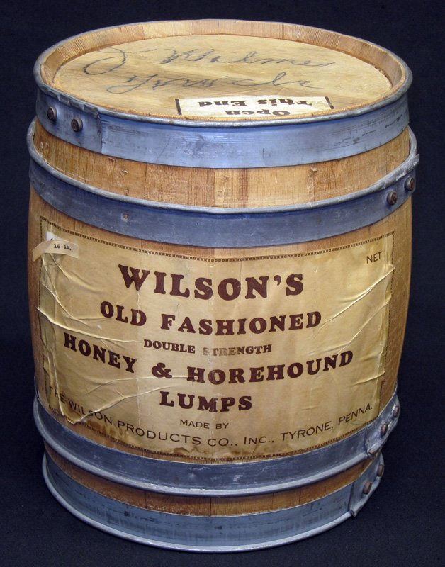 CANDY BARREL: Wilsons Honey & Horehound Lumps; wood with metal straps and paper litho; paper labels have creasing and staining; writing on top of barrel; H-11 1/2", G-VG
