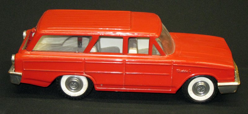 BUDDY L STATION WAGON: Pressed steel and plastic interior; bumper hitch tip appears broken; wear on bumpers; L-14 1/2", G-VG