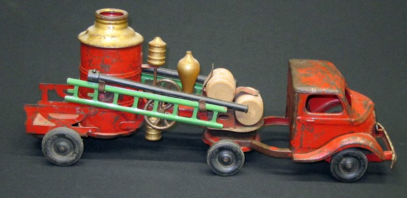 KINGSBURY STUDEBAKER FIRE BOILER: Pressed steel; mechanical; significant paint loss; wood barrels replaced; L-18", P-F