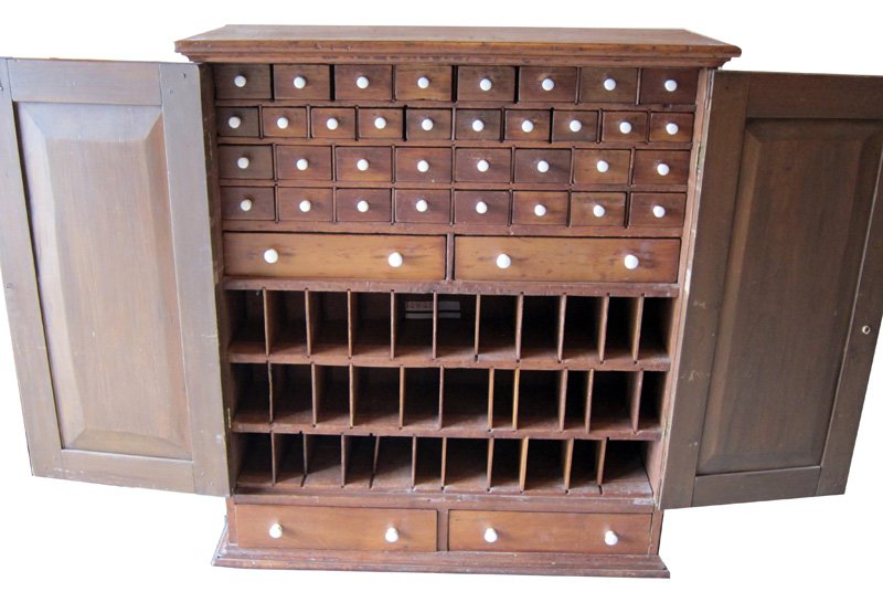 COUNTRY APOTHECARY STYLE CUPBOARD: (2) Paneled doors over (2) drawers; interior has (35) drawers over cubby holes; normal wear; some old restoration; H-43", W-38", G