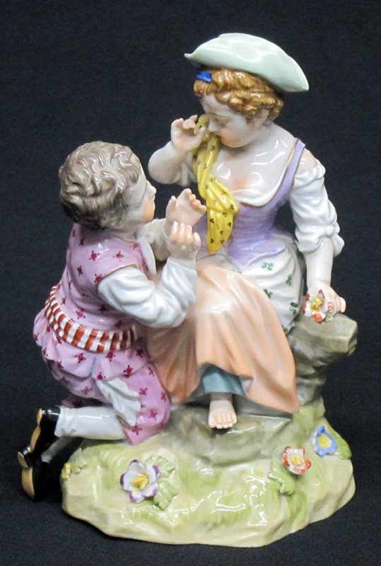 VIENNA PORCELAIN FIGURAL GROUP: Hand painted young boy and girl; blue beehive mark; very minor flower damage; H-7", VG-EX