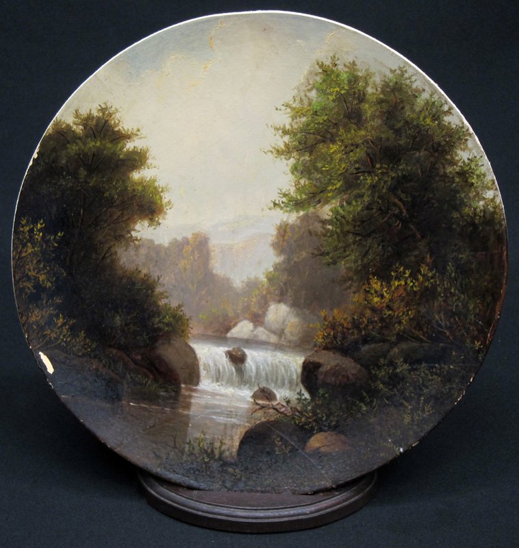 FRERICHS LANDSCAPE FLUE COVER: Painted papier mache; lake with waterfall; lower hairline; Dia.-10", G