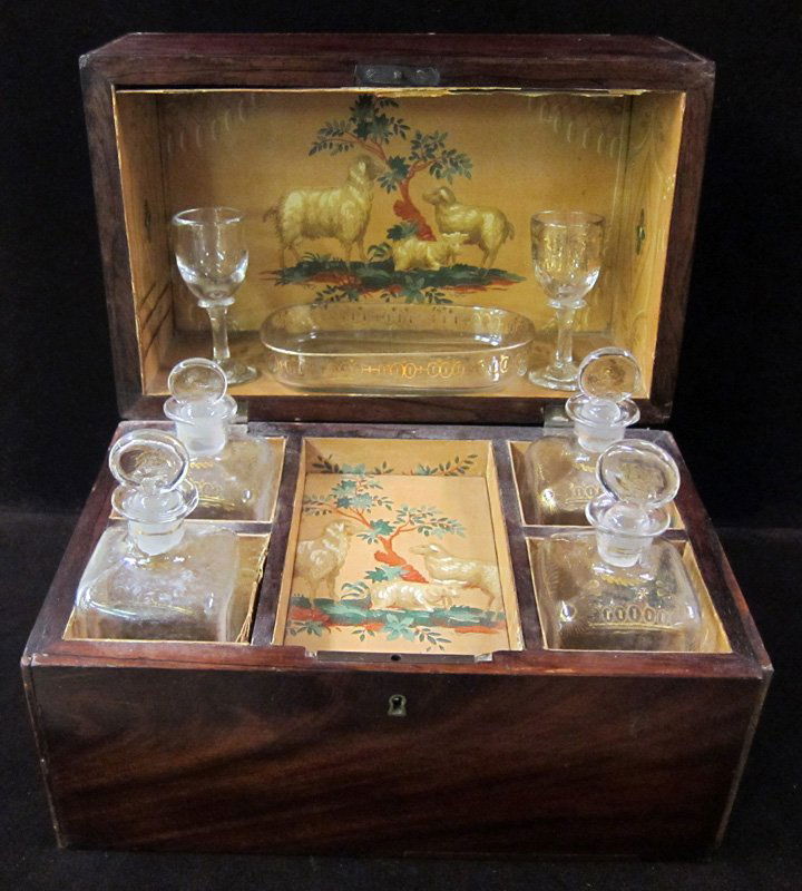 CELLARETTE: Inside fitted with four bottles, two glasses and tray, no key; missing one handle; 13" x 8" x 9 1/2", VG