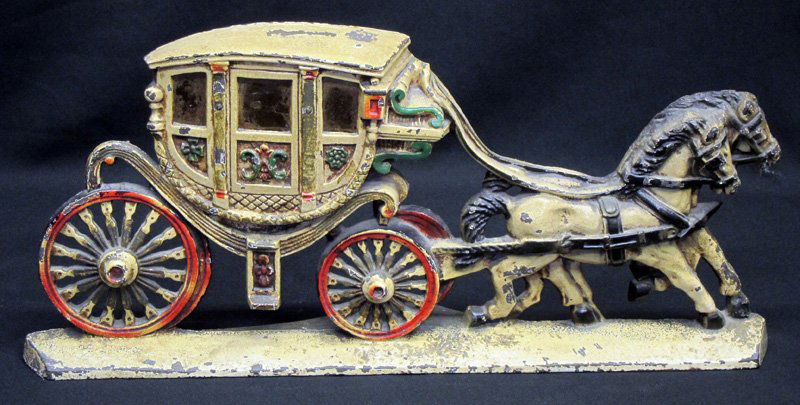 COACHING DOORSTOP: Painted cast iron; Eisenglass windows; some paint wear; L-19", G