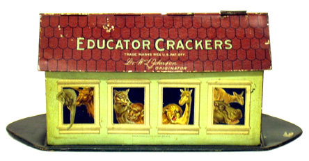 EDUCATOR CRACKERS FIGURAL ARK TIN: Attractive and desireable ark form with detailed images of animals front and back; overall crazing; roof has several small flaking spots. L-10 1/2", G-VG.