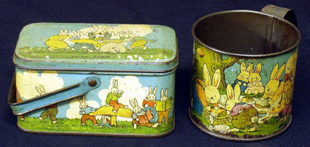 LOT OF 2 PETER RABBIT ITEMS: Litho tin; (1) candy box, (1) mug with pin-hole in bottom; some flaking; H-2 1/2"-3", F.