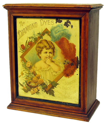 DIAMOND DYES CABINET: Litho tin front; sliding back doors; partially refinished case; tin has a few areas of flaking; some other crazing. H-20", F