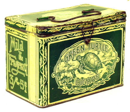 GREEN TURTLE CIGAR LUNCH BOX: Litho tin; top has dents and edges show considerable edge wear; sides are in better condition with some minor scratches and flaking. L-7 1/2", F-G.
