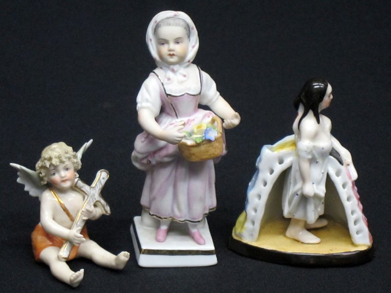 MINIATURE PORCELAIN FIGURINES (3): German, etc.; (1) cherub with cross: crown mark; (1) girl with flowers: crown and S mark; minor chip; (1) girl in gown and nightclothes - dissected view; H-2"-4 1/2", G-VG