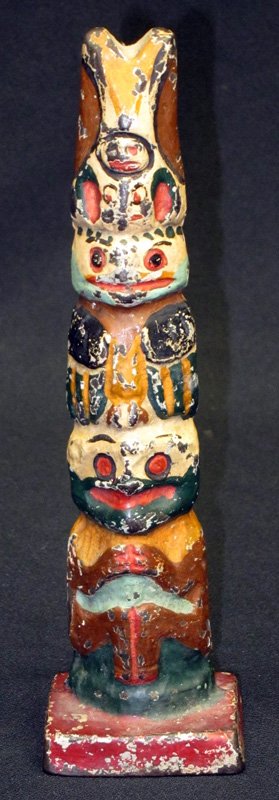 TOTEM POLE DOORSTOP: Painted cast iron; some chips and wear; H-9", G