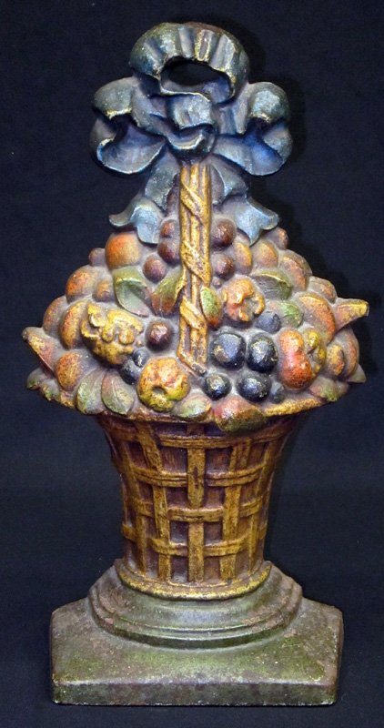 LARGE FRUIT BASKET DOORSTOP: C. J. O., painted cast iron; some wear, pitting and loss; H-17", F-G`