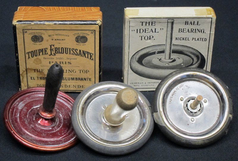 METAL TOPS (3): (1) Ideal top: Cushman & Denison NY, with original box; (1) Ideal top: parts, no box; (1) French "Dazzling Top", original box; Dia.-3", F-G