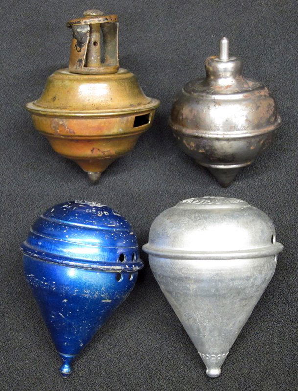 METAL TOPS (4): (2) Whistle, (1) King Scientific Co., (1) Irvings Wizard Top - gyro; (1) Siren King, (1) brass; H-2 1/2", F-G