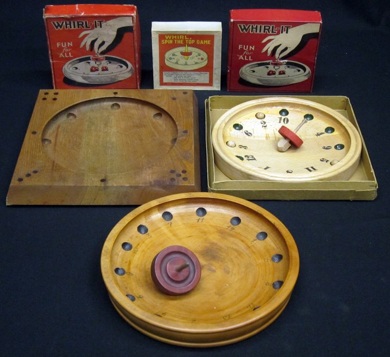 "WHIRL" TOP GAMES (6): Wood bases, tops and balls; (4) with original boxes; (2) non-packaged, missing balls and (1) spinner; largest 9" x 9", G-VG