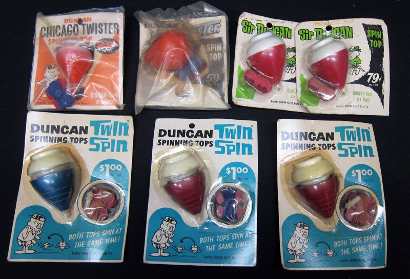DUNCAN TOPS (7): Original packaging; (3) Twin Spins, (2) Sir Duncan, (1) Spin Master, (1) Chicago Twister; some packaging torn and worn; tallest H-7", G-VG