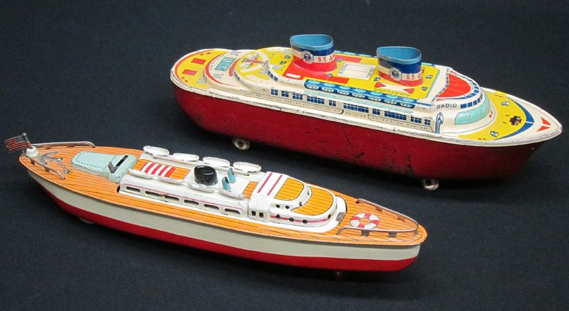 CRUISE LINE TOY BOATS (2): Litho tin; (1) Wyandotte S.S. America: somewear; (1) Japan: friction, top flips to form battleship; L-12", G-VG