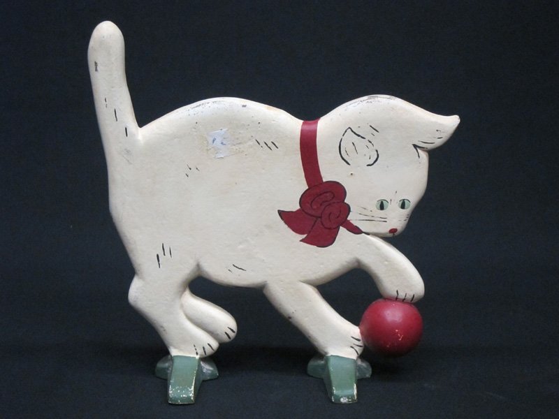 CAT WITH BALL DOORSTOP: Painted cast iron; repainted; H-9"
